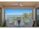 Relaxing balcony seating with stunning water view, perfect for enjoying the outdoors at 4993 Bacopa S Ln # 304, St Petersburg, FL 33715