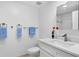 Fresh, white bathroom with modern fixtures and decorative touches at 4993 Bacopa S Ln # 304, St Petersburg, FL 33715