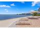 Lounge chairs sit on the beach overlooking the ocean at 4993 Bacopa S Ln # 304, St Petersburg, FL 33715