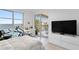 Bedroom featuring ocean views, balcony access, and sleek modern design at 4993 Bacopa S Ln # 304, St Petersburg, FL 33715