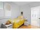 Charming bedroom with a yellow floral comforter and shuttered window at 4993 Bacopa S Ln # 304, St Petersburg, FL 33715