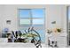 Bedroom with ocean view and a dedicated work space and exercise area at 4993 Bacopa S Ln # 304, St Petersburg, FL 33715