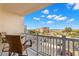 Relaxing outdoor balcony features a table with seating overlooking the neighborhood at 500 Treasure Island Cswy # 404, Treasure Island, FL 33706