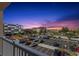 Balcony view showcasing city buildings, palm trees, and a picturesque sunset at 500 Treasure Island Cswy # 404, Treasure Island, FL 33706