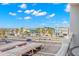 A nice outdoor balcony with a table set and great views of the city at 500 Treasure Island Cswy # 404, Treasure Island, FL 33706