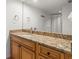 Bathroom with granite countertop vanity, silver fixtures, and a shower/tub combo with striped curtain at 500 Treasure Island Cswy # 404, Treasure Island, FL 33706