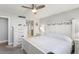 This bedroom is spacious with grey walls, white trim, and a light ceiling fan at 500 Treasure Island Cswy # 404, Treasure Island, FL 33706