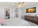 Comfortable bedroom featuring an accent wall and a television set on the wall at 500 Treasure Island Cswy # 404, Treasure Island, FL 33706