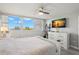 Bright bedroom featuring a large window with a picturesque view and light gray walls at 500 Treasure Island Cswy # 404, Treasure Island, FL 33706