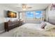 Bright bedroom with light, airy colors, natural light, and a ceiling fan at 500 Treasure Island Cswy # 404, Treasure Island, FL 33706