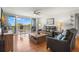 Bright living room featuring modern furniture, hardwood floors, and a balcony with a beautiful view at 500 Treasure Island Cswy # 404, Treasure Island, FL 33706