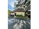 A charming, one-story home featuring a well-maintained lawn and a designated parking spot at 5627 Ashley Oaks Dr # 4, Tampa, FL 33617