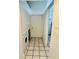 Hallway featuring a washer and dryer hookup and white tiling at 5627 Ashley Oaks Dr # 4, Tampa, FL 33617