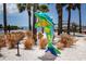 Colorful dolphin statue at Dunedin, Florida, a vibrant symbol of the community, set among lush landscaping at 567 Baywood S Dr, Dunedin, FL 34698