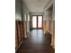 Hallway with tile floors and paneled doors, showing exposed studs at 567 Baywood S Dr, Dunedin, FL 34698