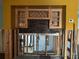 Kitchen area with exposed wall studs, with upper cabinets and brick backsplash at 567 Baywood S Dr, Dunedin, FL 34698