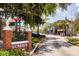 Charming street view in Dunedin, Florida with shops, trees, and the town's welcome sign at 567 Baywood S Dr, Dunedin, FL 34698