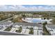 Expansive aerial shot features townhomes near a peaceful pond and green spaces at 6256 Shiner St, Land O Lakes, FL 34638