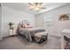 Bright bedroom featuring a cozy bed, vintage trunk, and calming decor at 6256 Shiner St, Land O Lakes, FL 34638