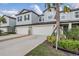 Well-maintained townhome exteriors showcasing attached garages, neutral color palettes, and tidy landscaping at 6256 Shiner St, Land O Lakes, FL 34638