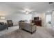 Upstairs living space with neutral tones, comfortable seating, and decorative TV console at 6256 Shiner St, Land O Lakes, FL 34638