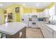 Functional kitchen featuring white cabinetry, modern appliances, and a convenient breakfast bar at 7301 Avocet Dr, Wesley Chapel, FL 33544