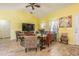 Comfortable living room featuring a ceiling fan, tv, and a cozy seating area at 7301 Avocet Dr, Wesley Chapel, FL 33544