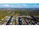 Aerial view of a canal-front community showcasing homes with private docks and lush landscaping at 7623 Mako Dr, Hudson, FL 34667