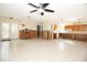 Spacious living room featuring tiled floors and undergoing renovation with exposed wall framing at 7623 Mako Dr, Hudson, FL 34667