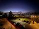 Night view of the coastline and car park with palm trees from a high point, overlooking the ocean at 817 Wilkie St, Dunedin, FL 34698