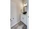 Cozy bathroom features a vessel sink, white vanity, and modern fixtures, creating a stylish and functional space at 817 Wilkie St, Dunedin, FL 34698