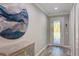 Elegant foyer with decorative flooring, a console table, and decorative glass front door at 817 Wilkie St, Dunedin, FL 34698