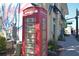 A British telephone booth is covered in advertising at 817 Wilkie St, Dunedin, FL 34698