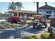 Street view of a tourist trolley and a golf cart at 817 Wilkie St, Dunedin, FL 34698