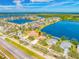 Expansive aerial view of community with lakes and perfectly manicured landscapes at 833 Seminole Sky Dr, Ruskin, FL 33570