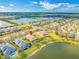 Aerial view of home's location on the lake with community and neighborhood at 833 Seminole Sky Dr, Ruskin, FL 33570