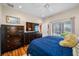 Bright and airy bedroom with a dark dresser and a neutral color scheme at 833 Seminole Sky Dr, Ruskin, FL 33570