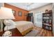 Cozy bedroom with an earth-tone color scheme, a ceiling fan and wood-look flooring at 833 Seminole Sky Dr, Ruskin, FL 33570