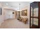 Bright living area featuring neutral walls, tiled floors, archways, and a glass display cabinet at 833 Seminole Sky Dr, Ruskin, FL 33570