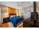 Stylish main bedroom featuring an accent wall, wood-look floors and soft, neutral lighting at 833 Seminole Sky Dr, Ruskin, FL 33570