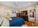 Bright main bedroom with an en-suite bathroom, neutral colors and a modern ceiling fan at 833 Seminole Sky Dr, Ruskin, FL 33570