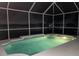 Covered pool with shimmering water offers a relaxing night swimming at 833 Seminole Sky Dr, Ruskin, FL 33570