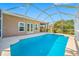 An in-ground pool with screen enclosure provides a relaxing oasis at 833 Seminole Sky Dr, Ruskin, FL 33570