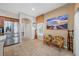 Bright sitting area with tile flooring, neutral walls, and a picture window showcasing the outside scenery at 833 Seminole Sky Dr, Ruskin, FL 33570