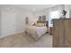 Bedroom features plush carpet, a window with natural light, and rustic decor at 9273 Highland Hills Dr, Hudson, FL 34667