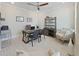 Well-lit home office featuring a ceiling fan, a desk, and a bookshelf creating a cozy and functional workspace at 9273 Highland Hills Dr, Hudson, FL 34667