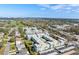 Community of condo buildings in a park-like setting with a pool and golf course views at 1706 Belleair Forest Dr # 348, Belleair, FL 33756