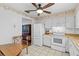 Functional kitchen with classic white appliances and plenty of cabinet space for all your cooking needs at 1706 Belleair Forest Dr # 348, Belleair, FL 33756