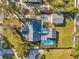 Birds eye view of the house with a large fenced in backyard with swimming pool and detached garage at 1016 Mandalay Dr, Brandon, FL 33511