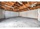 Spacious garage with high ceilings, concrete floor, and ample storage space at 1016 Mandalay Dr, Brandon, FL 33511